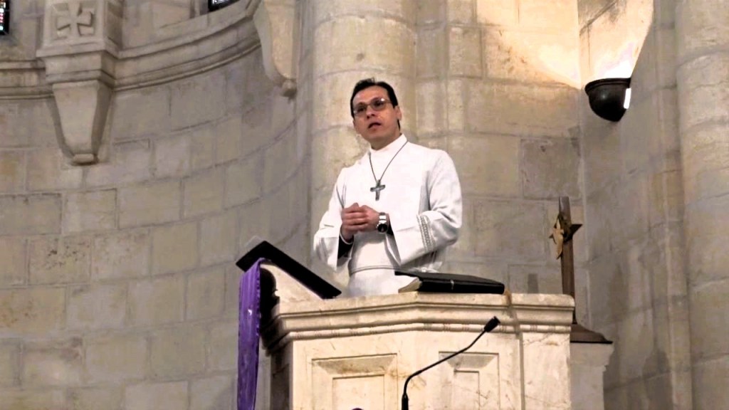 Rev. Dr. Munther Isaac preaches Christmas homily at Evangelical Lutheran church in Bethlehem, and describes Israeli bombing as genocide. 