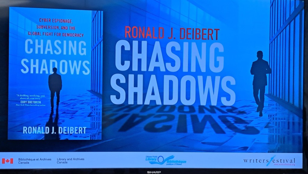 Image of book Chasing Shadows by Ronald J. Diebert projected onto a screen