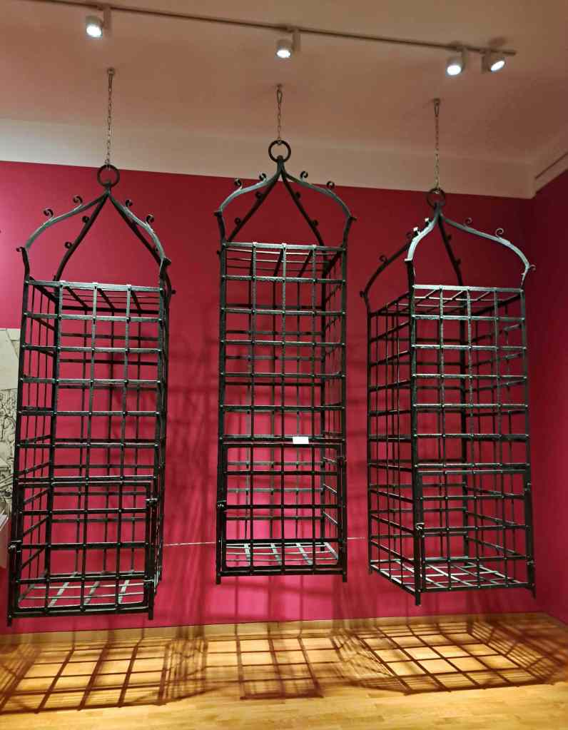Replicas in city museum in Münster, Germany of three metal cages which once contained the corpses of Anabaptists who rebelled against religious and civic leaders in 1534-35.
